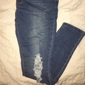 Blue Distressed at the Knee Jeans